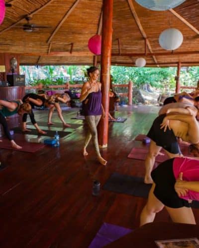 People doing yoga at resort with Dagmar instructing
